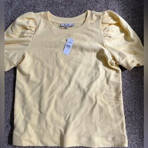 NWT Butter yellow blouse with pleated, puffy sleeves. Excellent condition.Size M